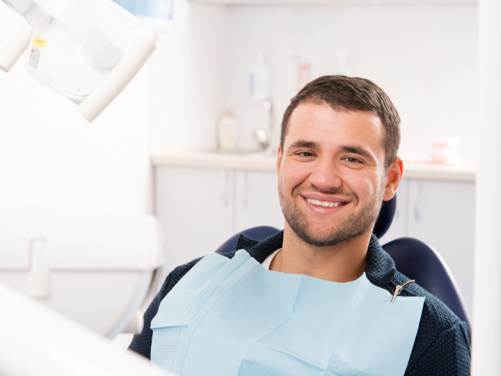 man-at-dental-checkup-maintaing-good-dental-health with our Dentist In Redmond